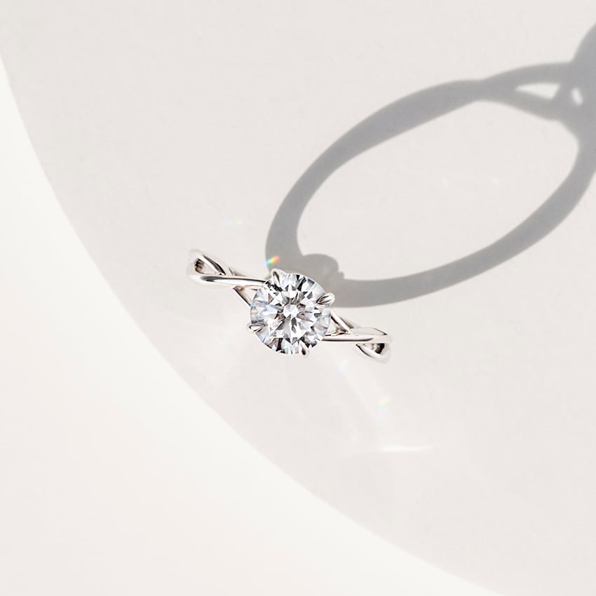 Alya Emerald Twist Solitaire Engagement Ring